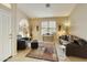 Living room with hardwood floors, leather furniture, and a decorative accent at 1918 E Saratoga St, Gilbert, AZ 85296