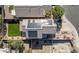 Aerial view showcasing the house's roof-mounted solar panels and backyard at 20219 N 33Rd Pl, Phoenix, AZ 85050