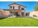 Two story home with backyard, covered patio, and basketball hoop at 20219 N 33Rd Pl, Phoenix, AZ 85050