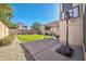 Large backyard with grassy area, patio, and basketball hoop at 20219 N 33Rd Pl, Phoenix, AZ 85050