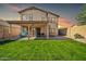 Covered patio, grassy lawn, and block wall at 20219 N 33Rd Pl, Phoenix, AZ 85050