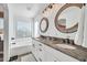 Elegant bathroom with double vanity, granite countertop, and soaking tub at 20219 N 33Rd Pl, Phoenix, AZ 85050