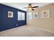 Spacious bedroom with two-tone walls and ceiling fan at 20219 N 33Rd Pl, Phoenix, AZ 85050