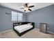 Bedroom with a twin bed, built-in shelving and ceiling fan at 20219 N 33Rd Pl, Phoenix, AZ 85050