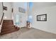 Bright entryway with staircase, front door, and mirror at 20219 N 33Rd Pl, Phoenix, AZ 85050