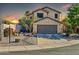 Two-story house with gray garage door and desert landscaping at 20219 N 33Rd Pl, Phoenix, AZ 85050