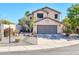 Two-story house with gray garage door and desert landscaping at 20219 N 33Rd Pl, Phoenix, AZ 85050