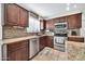 Modern kitchen featuring granite countertops and stainless steel appliances at 20219 N 33Rd Pl, Phoenix, AZ 85050