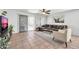 Living room with L-shaped sofa, tile floor, and backyard access at 20219 N 33Rd Pl, Phoenix, AZ 85050