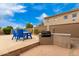 Outdoor kitchen with built-in grill and ample counter space at 20546 N 83Rd Pl, Scottsdale, AZ 85255