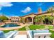 Inviting backyard with a sparkling pool, patio, and lush landscaping at 20546 N 83Rd Pl, Scottsdale, AZ 85255