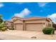 Two-car garage with neutral color scheme and landscaping at 20546 N 83Rd Pl, Scottsdale, AZ 85255