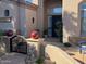 Elegant entryway with decorative red spheres and a modern black gate at 20546 N 83Rd Pl, Scottsdale, AZ 85255