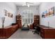 Home office with built-in wooden desk and comfortable chair at 20546 N 83Rd Pl, Scottsdale, AZ 85255