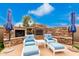 Relaxing patio area with a stone fireplace and comfortable seating at 20546 N 83Rd Pl, Scottsdale, AZ 85255