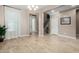 Light and airy dining room with wood-look floors and access to the kitchen at 2114 W Red Fox Rd, Phoenix, AZ 85085