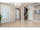 Light and airy dining room with wood-look floors and access to the kitchen at 2114 W Red Fox Rd, Phoenix, AZ 85085