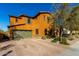 Two-story house with a green garage door and a brick driveway at 2114 W Red Fox Rd, Phoenix, AZ 85085