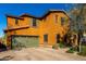 Two-story house with a green garage door and a brick driveway at 2114 W Red Fox Rd, Phoenix, AZ 85085