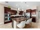 Modern kitchen featuring center island, stainless steel appliances, and ample cabinetry at 2114 W Red Fox Rd, Phoenix, AZ 85085