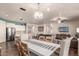 Open dining area with kitchen views and a farmhouse table at 21268 N 266Th Ln, Buckeye, AZ 85396