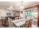 Bright dining area with sliding doors leading to the backyard at 21268 N 266Th Ln, Buckeye, AZ 85396