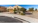 Single-story home with desert landscaping and a two-car garage at 21268 N 266Th Ln, Buckeye, AZ 85396