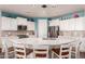 Eat-in kitchen featuring a large island with seating and modern appliances at 21268 N 266Th Ln, Buckeye, AZ 85396