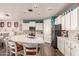 Spacious kitchen with island, stainless steel appliances, and white cabinetry at 21268 N 266Th Ln, Buckeye, AZ 85396