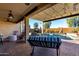 Relaxing pool area with covered patio and lounge chairs at 21268 N 266Th Ln, Buckeye, AZ 85396