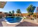 Inviting kidney-shaped pool with a large patio at 21268 N 266Th Ln, Buckeye, AZ 85396