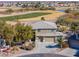 Two-story house with a three-car garage, and a golf course view at 22155 N Cline Ct, Maricopa, AZ 85138