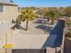 Aerial view of the backyard showing a pool and palm trees at 22155 N Cline Ct, Maricopa, AZ 85138