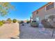 Large backyard with gravel landscaping and a view of the house at 22155 N Cline Ct, Maricopa, AZ 85138