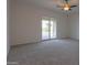 Bright bedroom with sliding door to access backyard pool at 22155 N Cline Ct, Maricopa, AZ 85138