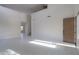 Bright living room featuring tile floors and a modern door at 22155 N Cline Ct, Maricopa, AZ 85138