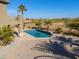 Luxury pool and spa with palm trees and a golf course view at 22155 N Cline Ct, Maricopa, AZ 85138