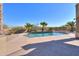 Inviting kidney-shaped pool with a waterfall feature at 22155 N Cline Ct, Maricopa, AZ 85138