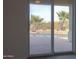 View of a refreshing pool and backyard oasis from sliding glass doors at 22155 N Cline Ct, Maricopa, AZ 85138