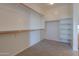 Large walk-in closet with ample shelving and hanging space at 22155 N Cline Ct, Maricopa, AZ 85138