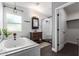 Modern bathroom with a soaking tub, walk-in shower, and subway tile at 2614 N 15Th St, Phoenix, AZ 85006