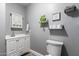 Clean bathroom with white vanity, floating shelves, and toilet at 2614 N 15Th St, Phoenix, AZ 85006