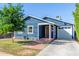 Front view of a renovated blue house with a white garage at 2614 N 15Th St, Phoenix, AZ 85006