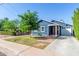 Blue house with a brick driveway and a well-maintained lawn at 2614 N 15Th St, Phoenix, AZ 85006