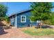 Side view of a charming blue house with a brick walkway and a tree at 2614 N 15Th St, Phoenix, AZ 85006