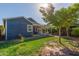 Back exterior view of charming blue house with a patio at 2614 N 15Th St, Phoenix, AZ 85006