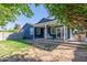 Back exterior view of charming blue house with a patio at 2614 N 15Th St, Phoenix, AZ 85006