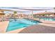 Community pool with shade structures and accessibility features at 2722 Leisure World --, Mesa, AZ 85206