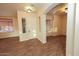 Bright and airy entryway with wood-look flooring and access to other rooms at 2740 S Honeysuckle Ln, Gilbert, AZ 85295