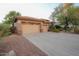 Two-car garage with a large driveway, offering ample parking space at 2740 S Honeysuckle Ln, Gilbert, AZ 85295